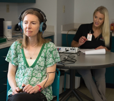 SIUE speech-language pathology graduate student Courtney Turner performed a hearing screening on Serena Ball at the Edwardsville Public Library.