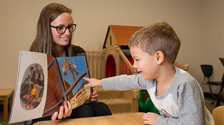 SIUE speech language pathology graduate student clinician Chelsey Short works with four-year-old Holden during a therapy session in the Speech Language Hearing Center on campus.