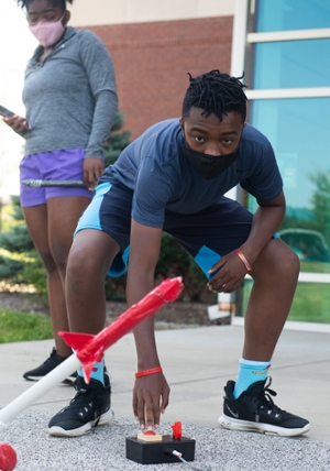 Loyal C. Flanders, a freshman at Althoff High School in Belleville, launches a rocket he assembled.