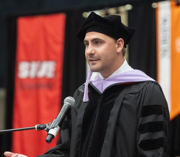 Student speaker Joshua Koerner at the podium