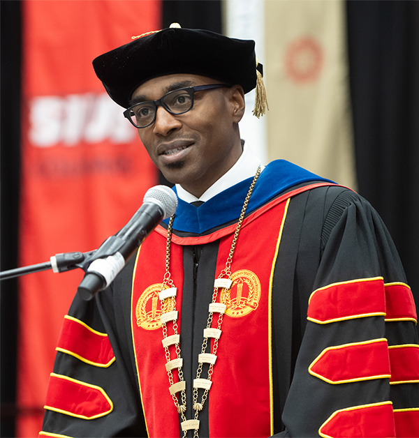 Chancellor James T Minor speaks from the podium