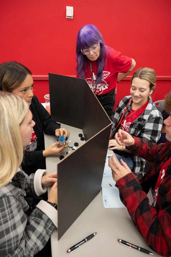 Teacher and students perform table activity