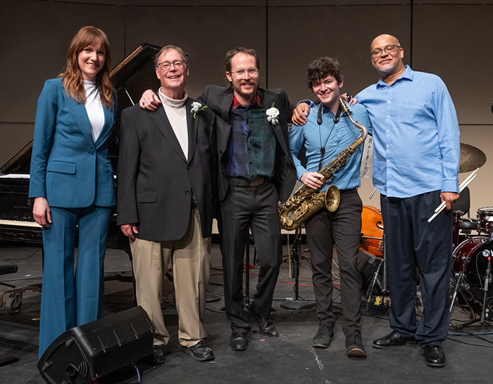 Group shot of the famous guest alumni jazz musicians, with professor emeritus Brett Stamps