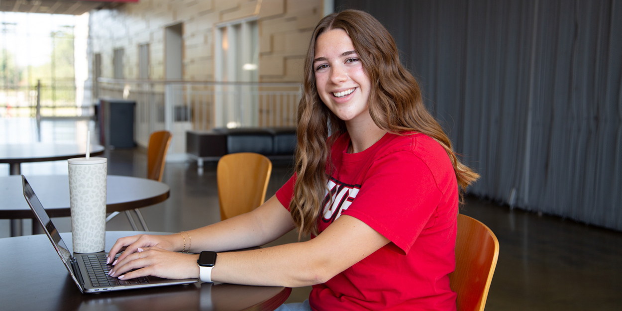 A students at SIUE using a computer.